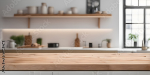 Wooden tabletop counter in front of bright modern kitchen.