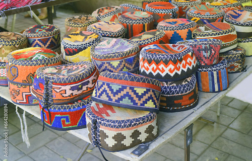 Stacks of Vibrant Colored Armenian Traditional Hats Called Arakhchin for Sale at Vernissage Market in Yerevan, Armenia photo