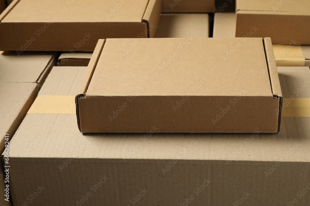 Many cardboard boxes as background, closeup. Packaging goods Many cardboard boxes as background, closeup. Packaging goods