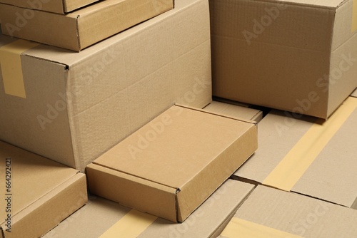 Many cardboard boxes as background, closeup. Packaging goods © New Africa