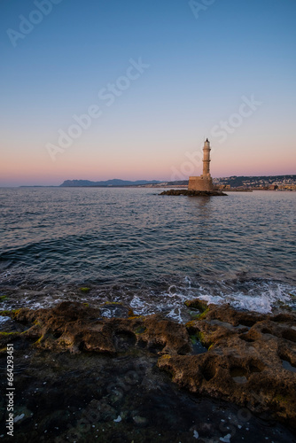 Chania's Lighthouse pier in the shore of quiet Mediterranean Sea in Crete, Greece