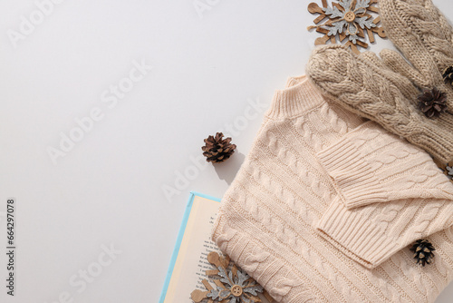 Warm knitted mittens with a sweater and cones