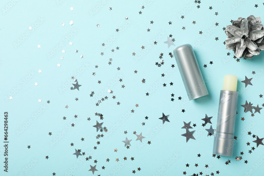 lip balm and cone on blue background, space for text lip balm and cone on blue background, space for text