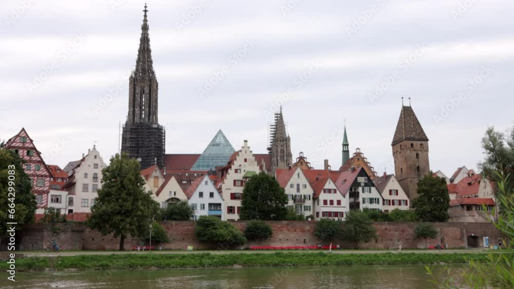 Church steeple, row houses in Ulm, Germany, across Danube River Church steeple, row houses in Ulm, Germany, across Danube River