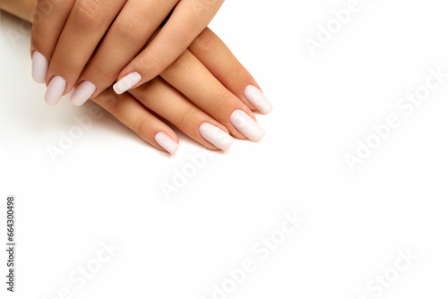 Hands of young woman with beautiful manicure isolated on white background