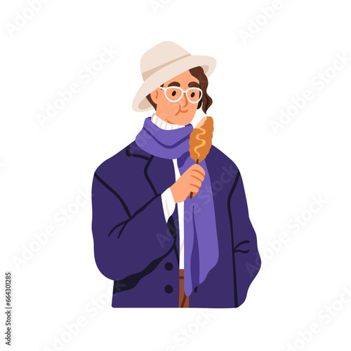 Man eating Korean fast food, mozzarella corn dog. Person holding Korea street...