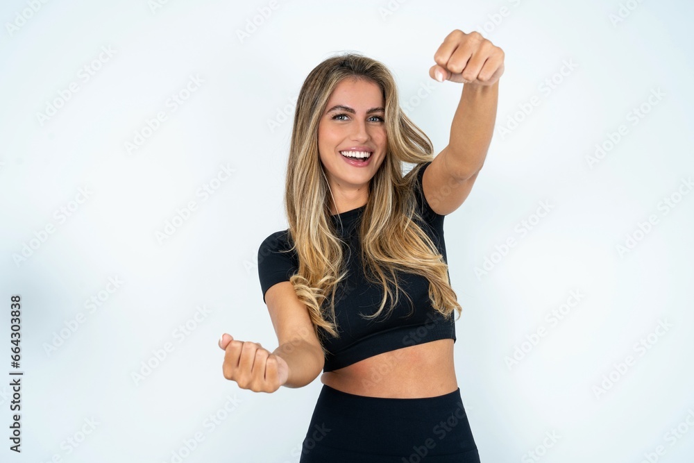 caucasian woman wearing sport clothes imagine steering wheel helm rudder passing driving exam good mood fast speed caucasian woman wearing sport clothes imagine steering wheel helm rudder passing driving exam good mood fast speed