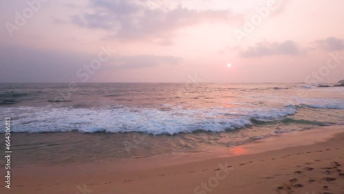Wallpaper Mural Evening landscape on a tropical island. The sun on the right side of the frame, the sunset sky and its reflection in the ocean waves. Horizon at the center of the frame Torontodigital.ca