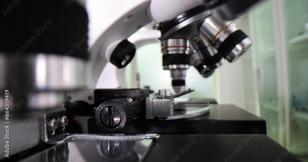 Many microscopes on table in chemical laboratory closeup. Scientific and healthcare Many microscopes on table in chemical laboratory closeup. Scientific and healthcare