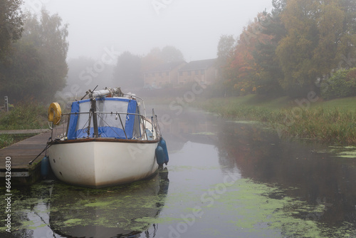 House barges on the Forth and Clyde Canal in Scotland on a cold and misty winters morning  photo