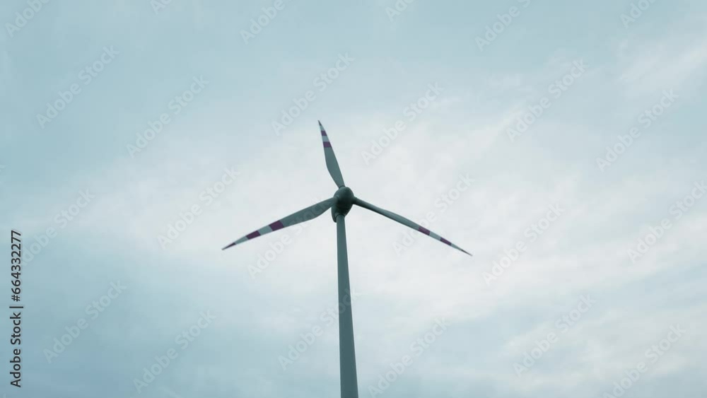 Wind turbine in a field for sustainable energy and against climate change and global warming, cinematic style Wind turbine in a field for sustainable energy and against climate change and global warming, cinematic style