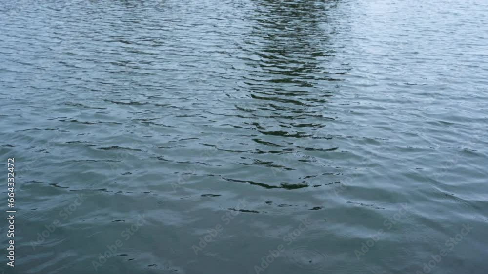 Calm, relaxing, blue ocean waves reflecting light on a cloudy day Calm, relaxing, blue ocean waves reflecting light on a cloudy day