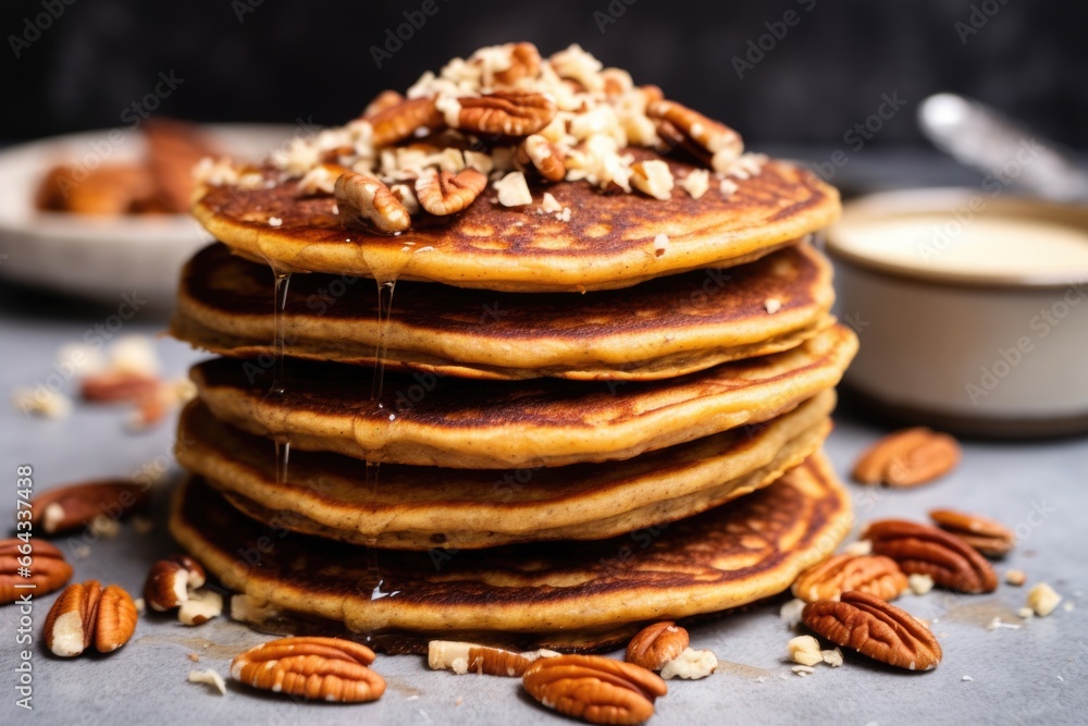 a closeup of vegan vanilla pancakes with pecan nuts