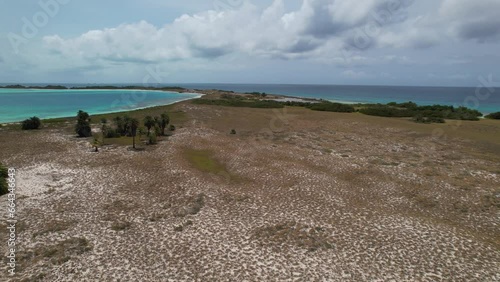 Most peaceful place on caribbean island, aerial view pan right over tropical island, cayo de agua photo