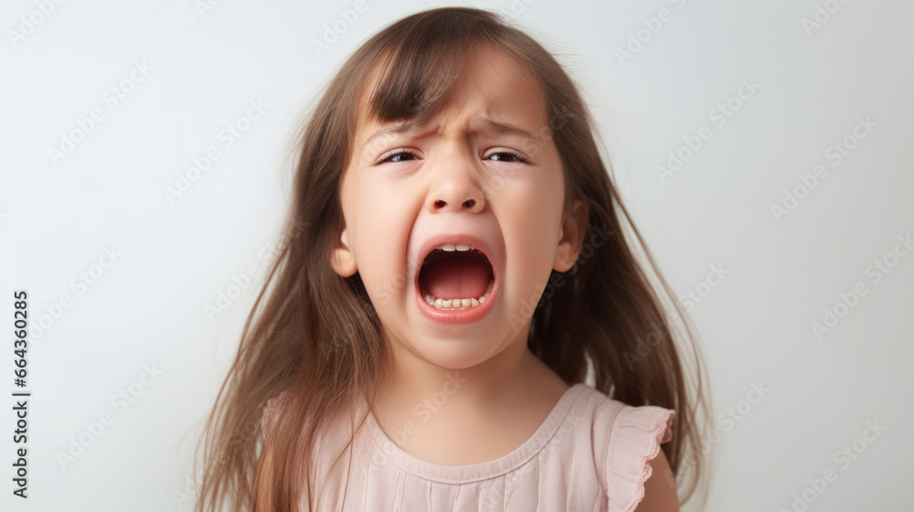 Cute little child is crying on a white background. Сlose-up portrait of a crying baby Cute little child is crying on a white background. Сlose-up portrait of a crying baby