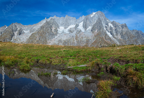 The Grandes Jorasses, one of the massifs of Mont Blanc, more spectacular and majestic of all the Alps, during a sunny autumn day, near the town of Courmayeur, Italy