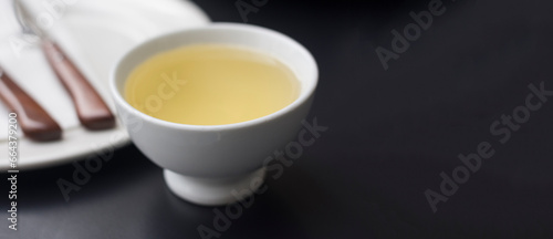 cup of white wine Ribeiro on black table, Galicia, copy space  photo