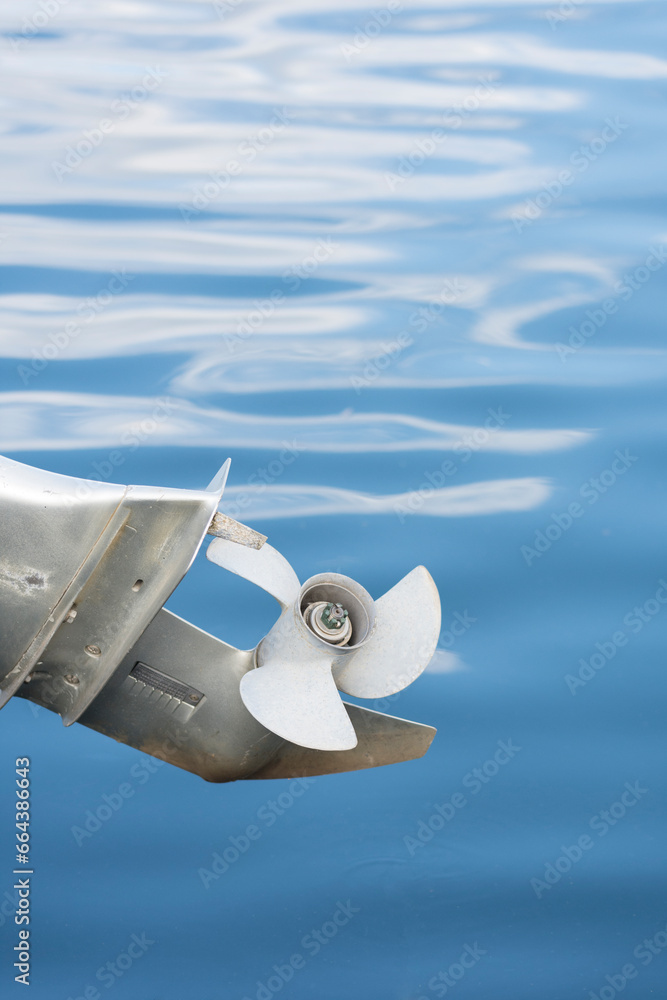 Propeller of an outboard motor out of water Propeller of an outboard motor out of water