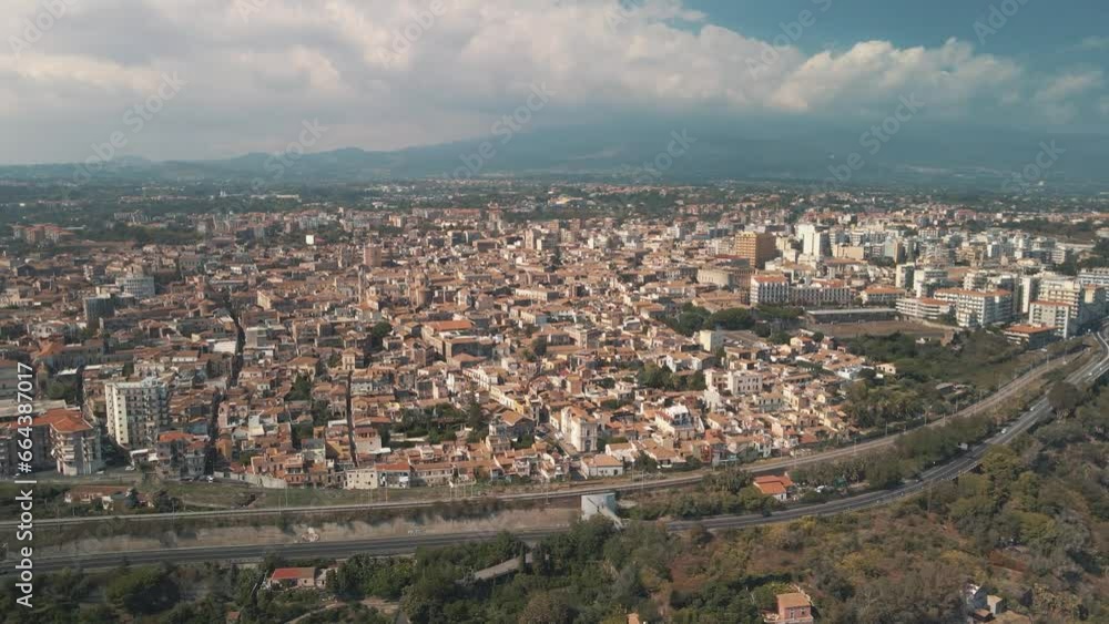 Aerial view of Acireale along the coastline with Etna Volcano during eruption in background, Catania province, Sicily, Italy. Aerial view of Acireale along the coastline with Etna Volcano during eruption in background, Catania province, Sicily, Italy.