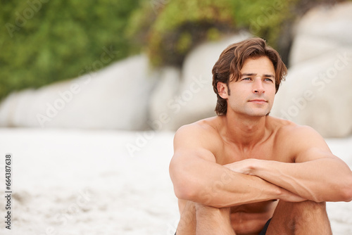 Man, beach and sand thinking relax for vacation plans, summer sunshine holiday, or tropical ocean. Male person, thoughts idea or outdoor view or sea salt hair for lazy weekend, fresh air or wondering