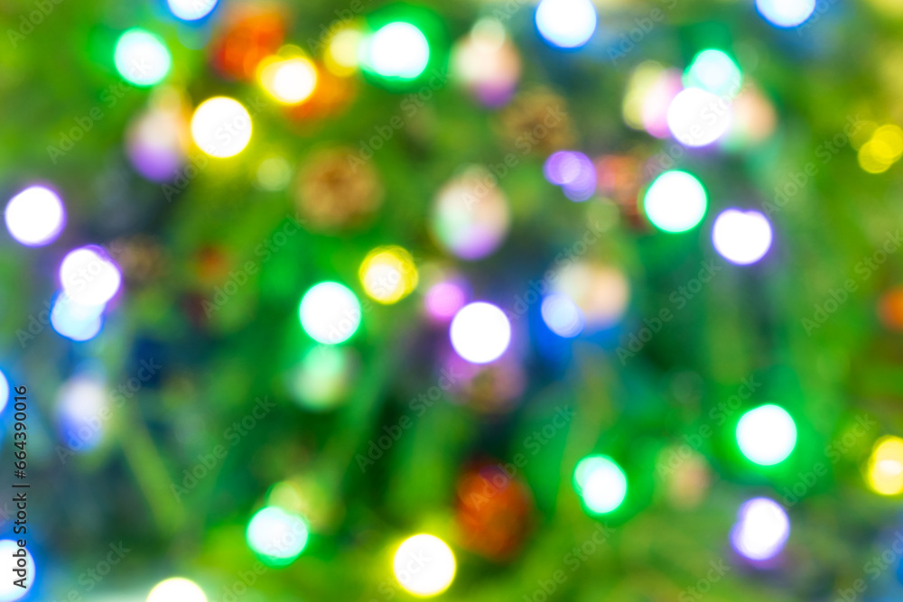Bokeh lights up the background. Abstract multicolored light. Blurred lights on Christmas tree, Christmas background