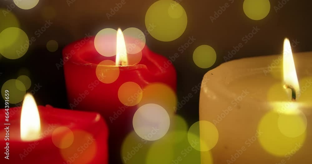 Animation of light spots over candles at christmas Animation of light spots over candles at christmas