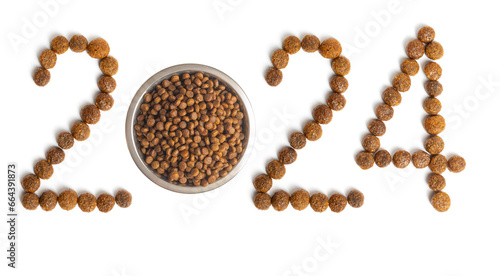 Calendar 2024 from Dry pet food and a bowl full of crispy granules on a white background.