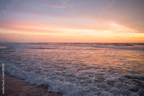 Beautiful Romantic Sunset sea sand beach. Landscape of paradise tropical island beach  sunrise shot. beach landscape. Beautiful cloudscape over the sea sunrise shot.