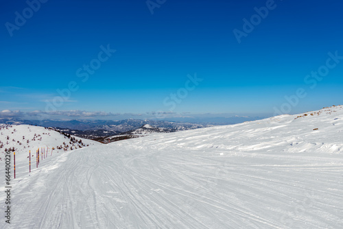 Breathtaking scenery on the snowy slopes of Vasilitsa ski center, Grevena, Greece © kokixx
