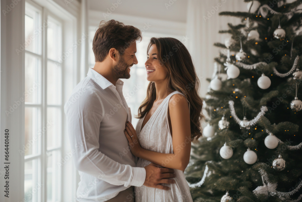 Happy beautiful couple celebrating Christmas at home Happy beautiful couple celebrating Christmas at home