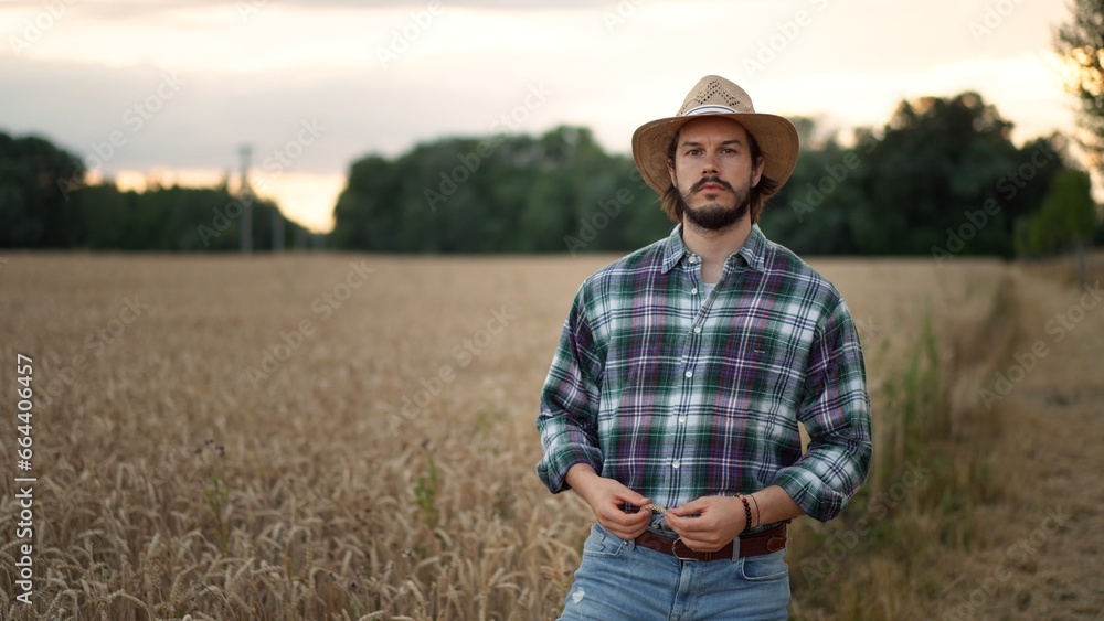 Portrait of the joyful happy caucasian man farmer in a hat looking and smiling Portrait of the joyful happy caucasian man farmer in a hat looking and smiling