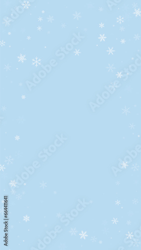 Beautiful snowfall christmas background. Subtle flying snow flakes and stars on light blue winter backdrop. Beautiful snowfall overlay template. Vertical vector illustration.
