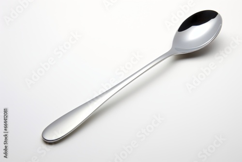 A stainless steel spoon isolated on a white background