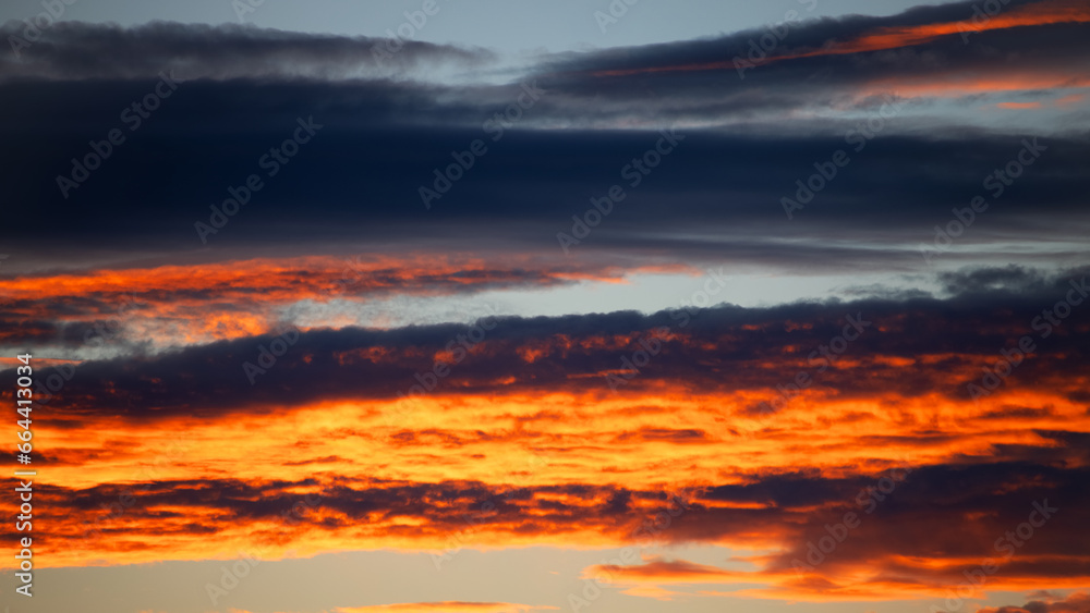 Textured background of beautiful sunset. Beautiful background blur. Amazing red and yellow sunset with 