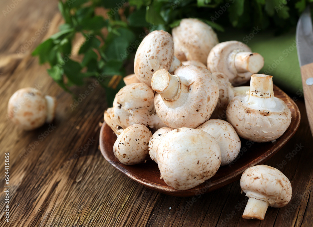 natural organic mushrooms champignons on the table