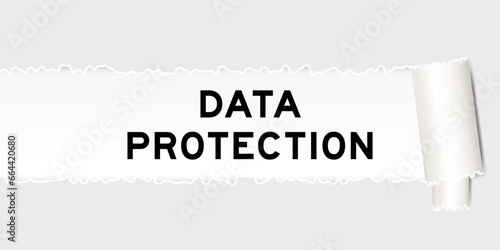 Ripped gray paper background that have word data protection under torn part