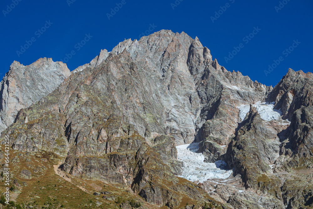 The Grandes Jorasses, one of the massifs of Mont Blanc, more spectacular and majestic of all the Alps, during a sunny autumn day, near the town of Courmayeur, Italy