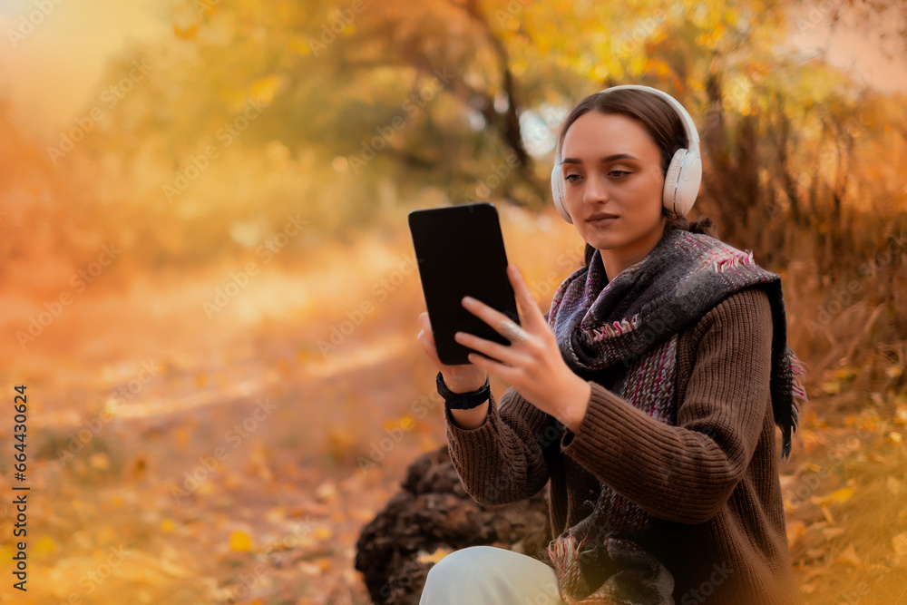 Tablet, backpack and woman traveling in nature in the forest in search of adventure, weekend trip or vacation, digital technology, map in the phone, taking a photo of herself on the phone Tablet, backpack and woman traveling in nature in the forest in search of adventure, weekend trip or vacation, digital technology, map in the phone, taking a photo of herself on the phone
