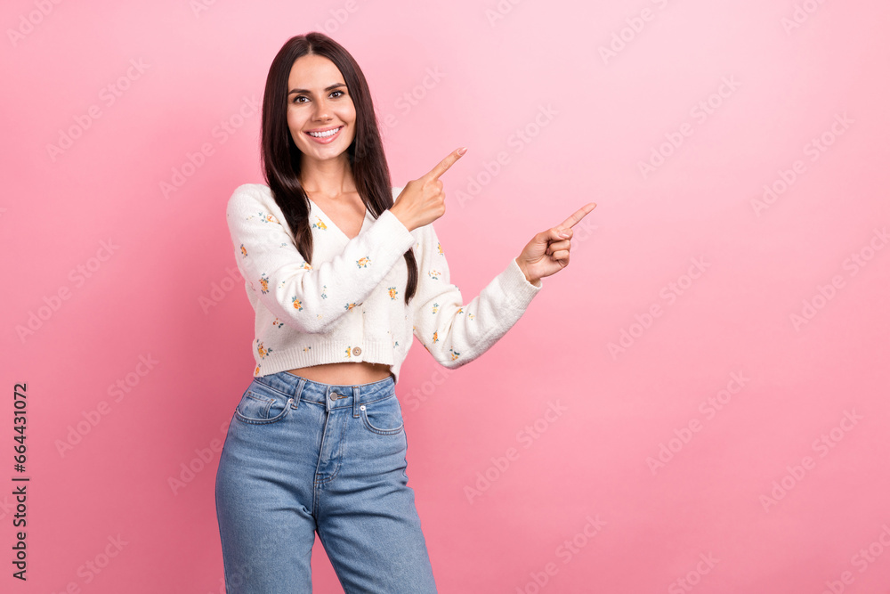 Photo of attractive happiness woman young age pointing fingers novelty promo billboard black friday isolated on pink color background Photo of attractive happiness woman young age pointing fingers novelty promo billboard black friday isolated on pink color background