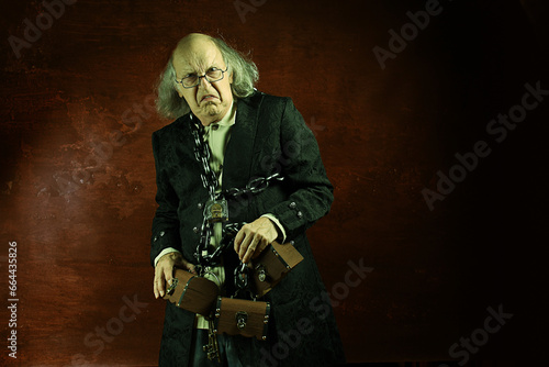 фотографія Ghost of Jacob Marley, Scrooge ex-business partner, chained with a padlock, carr