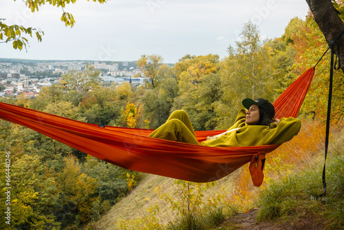 chilling woman laying down in hammock