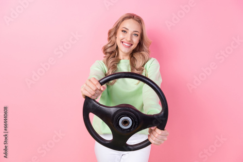 Photo of wear stylish pullover girl blonde curls not stupid can drive automobile easy steering wheel bmw isolated on pink color background