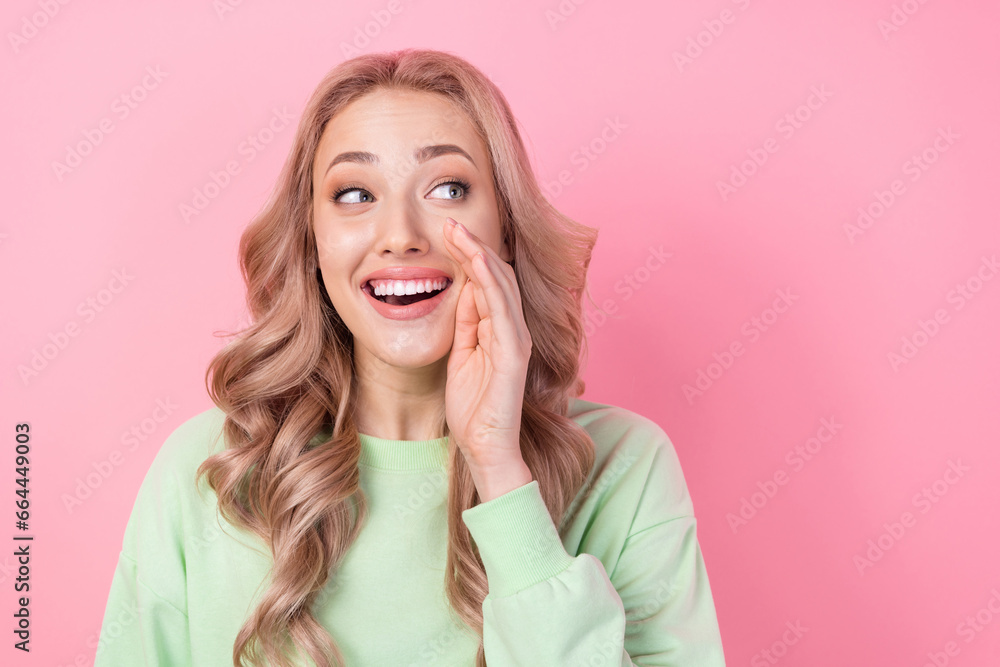 Photo of girl wear green pullover hand cheek speech announce secret government information look novelty isolated on pink color background Photo of girl wear green pullover hand cheek speech announce secret government information look novelty isolated on pink color background