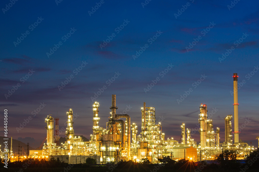 Oil​ refinery​ and​  plant and tower column of Petrochemistry industry in oil​ and​ gas​ ​industrial with​ cloud​ blue​ ​sky the morning