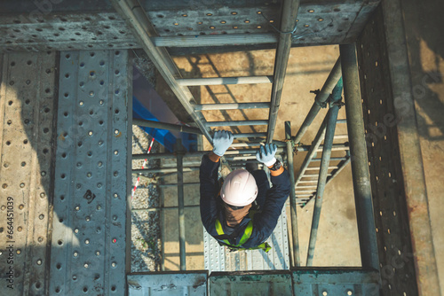 Male climb the stairway storage visual inspection tank