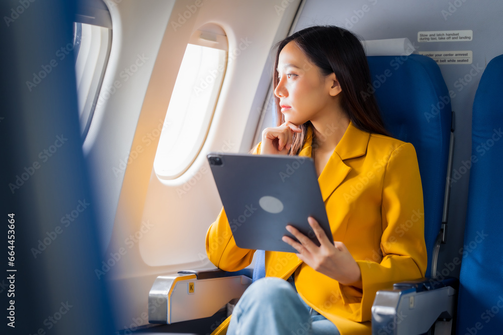 Female airplane passengers asian chinese people Entrepreneurs on Flight, Venturing Overseas Investments. Global Business Expansion, Foreign Markets, Strategic Financial Moves. Women in Business Suits Female airplane passengers asian chinese people Entrepreneurs on Flight, Venturing Overseas Investments. Global Business Expansion, Foreign Markets, Strategic Financial Moves. Women in Business Suits