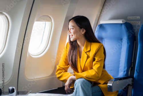 Female airplane passengers asian chinese people Entrepreneurs on Flight, Venturing Overseas Investments. Global Business Expansion, Foreign Markets, Strategic Financial Moves. Women in Business Suits
