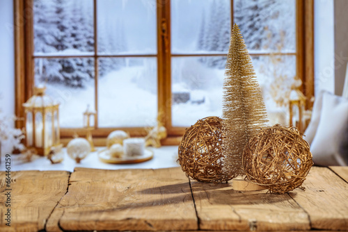 Wooden desk of free space and winter window background. Christmas time and cold winter day. Empty space for your products.