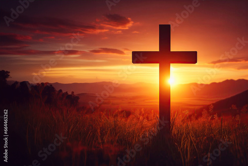The cross standing on meadow sunset and flare background. Cross on a hill as the morning sun comes up for the day. The cross symbol for Jesus Christ. Easter background concept and The crosses sign. photo