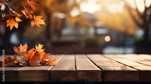 A wooden tabletop with a red-yellow leaf-laden background offers a dreamy Autumnal vibe.